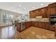 Spacious kitchen with wood cabinets, granite countertops, and stainless steel appliances at 7224 St Clair Dr, Charlotte, NC 28270