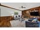 Relaxing living room with a fireplace, built-in shelving, and comfortable seating with natural light at 7224 St Clair Dr, Charlotte, NC 28270