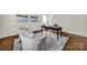 Bright living room with hardwood floors, cozy seating, and modern decor at 7224 St Clair Dr, Charlotte, NC 28270