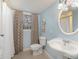 Charming bathroom featuring a pedestal sink, tile floor and shower/tub combination at 7300 Falkirk Pl, Charlotte, NC 28270