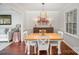 Elegant dining room with wood floors and a view into the living room at 7300 Falkirk Pl, Charlotte, NC 28270
