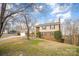 Inviting two-story home featuring a brick and siding exterior and a well-kept front yard at 7300 Falkirk Pl, Charlotte, NC 28270