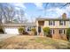 Charming home with a well-maintained lawn, brick facade, and a spacious two-car garage at 7300 Falkirk Pl, Charlotte, NC 28270