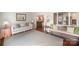 Spacious living room boasts hardwood floors, neutral paint, and lots of natural light at 7300 Falkirk Pl, Charlotte, NC 28270
