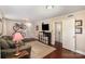Cozy living room featuring hardwood floors, TV, bicycles on the wall, and comfortable seating at 7300 Falkirk Pl, Charlotte, NC 28270