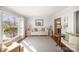 Bright living room featuring large window, plush carpet, and neutral paint at 7300 Falkirk Pl, Charlotte, NC 28270