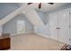 Upstairs bedroom showcasing a unique ceiling with lots of natural light at 8018 Cotton St, Harrisburg, NC 28075
