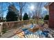 Outdoor deck showcases a vibrant rug and comfortable seating with nice view at 8018 Cotton St, Harrisburg, NC 28075