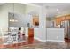 Open floor plan connecting the dining area, kitchen, and living room, perfect for modern living at 8018 Cotton St, Harrisburg, NC 28075