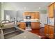 Well-lit kitchen featuring wood cabinets, stainless steel appliances, and dark countertops at 8018 Cotton St, Harrisburg, NC 28075