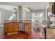 Open concept kitchen with stainless steel appliances and adjacent dining area filled with natural light at 8018 Cotton St, Harrisburg, NC 28075