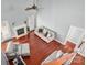 Open-concept living room featuring hardwood floors, a fireplace, and comfortable seating at 8018 Cotton St, Harrisburg, NC 28075
