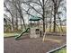Community playground featuring a play structure and swing set at 8018 Cotton St, Harrisburg, NC 28075