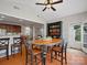 Dining area features hardwood flooring, modern ceiling fan and open kitchen access at 809 Circle Trace Rd, Monroe, NC 28110