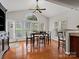 Dining area features hardwood flooring, and large windows providing natural light at 809 Circle Trace Rd, Monroe, NC 28110
