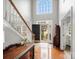 Bright foyer with high ceilings, hardwood floors, staircase, and natural light streaming in at 809 Circle Trace Rd, Monroe, NC 28110