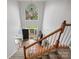 Bright foyer with tall window and chandelier, hardwood stairs, and a dark front door with sidelights at 809 Circle Trace Rd, Monroe, NC 28110