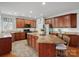Spacious kitchen features granite countertops, stainless steel appliances and central island with breakfast bar at 809 Circle Trace Rd, Monroe, NC 28110