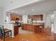 Open kitchen with a central island, wooden cabinetry, and modern appliances at 809 Circle Trace Rd, Monroe, NC 28110