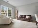 Inviting living room with plush seating, a grandfather clock, and ample natural light at 809 Circle Trace Rd, Monroe, NC 28110
