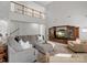 Open-concept living room with a loft view, fireplace, and entertainment center at 809 Circle Trace Rd, Monroe, NC 28110