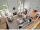 Aerial view of a living room with fireplace, high ceilings, and large windows at 809 Circle Trace Rd, Monroe, NC 28110