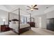 Main bedroom with tray ceilings features a canopy bed and ensuite bath at 809 Circle Trace Rd, Monroe, NC 28110