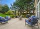 Relaxing patio area with plush seating, a fire pit, and lush landscaping at 809 Circle Trace Rd, Monroe, NC 28110