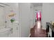 Hallway bathroom features a shower and tub, with decorated shelves on the wall at 8721 Brampton Dr, Charlotte, NC 28215