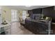 Inviting living room with wood floors, fireplace, and large windows allowing ample natural light at 8721 Brampton Dr, Charlotte, NC 28215