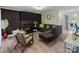 Modern living room features stylish furnishings, wood floors, and cozy fireplace at 8721 Brampton Dr, Charlotte, NC 28215