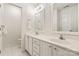 Well-lit bathroom featuring dual sinks and vanities with tiled floors at 9036 Saint Thomas Ln, Charlotte, NC 28277