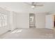 Expansive bedroom with neutral carpet; ensuite bathroom entrance visible at 9036 Saint Thomas Ln, Charlotte, NC 28277