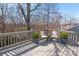 Outdoor deck with seating overlooking a lush, wooded backyard at 9036 Saint Thomas Ln, Charlotte, NC 28277