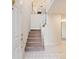 Bright foyer with a staircase, white walls, and tile flooring creating a welcoming entrance at 9036 Saint Thomas Ln, Charlotte, NC 28277