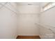 Spacious walk-in closet with neutral carpet and wire shelving at 9036 Saint Thomas Ln, Charlotte, NC 28277