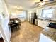 Well-lit kitchen with stainless steel appliances, white cabinets, and a dining area for Gathering meals at 911 Union Ter, Gastonia, NC 28056