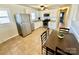 Bright kitchen with stainless steel appliances, white cabinets, and a dining area for Gathering meals at 911 Union Ter, Gastonia, NC 28056