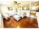 Bright living room with hardwood floors, neutral paint, open to the kitchen, and great natural light at 911 Union Ter, Gastonia, NC 28056
