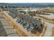 Overhead view of townhomes and a scenic pond with a fountain feature in a well-maintained community at 919 Pennington Dr, Indian Land, SC 29720