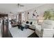 Spacious living area flowing into the dining space, furnished with modern decor and bright accents at 919 Pennington Dr, Indian Land, SC 29720