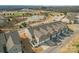 Aerial view of townhomes overlooking a pond and a park with baseball fields at 919 Pennington Dr, Indian Land, SC 29720