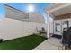 Backyard featuring a well-maintained lawn and a charming patio area with comfortable seating at 919 Pennington Dr, Indian Land, SC 29720