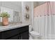 Cozy bathroom features granite counters, modern fixtures, and unique decorative accents at 919 Pennington Dr, Indian Land, SC 29720