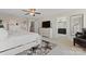 Spacious bedroom featuring neutral colors, a ceiling fan, and access to a bathroom at 919 Pennington Dr, Indian Land, SC 29720