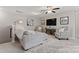 Comfortable bonus room with a plush sofa, a ceiling fan, and stylish decor at 919 Pennington Dr, Indian Land, SC 29720