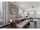 Dining area boasts a rustic wooden table, bench seating, and view into the living area at 919 Pennington Dr, Indian Land, SC 29720