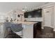 Spacious kitchen island with granite countertop and dark cabinets; open layout at 919 Pennington Dr, Indian Land, SC 29720