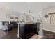 Kitchen with island and stainless dishwasher, view to living room and dining area at 919 Pennington Dr, Indian Land, SC 29720