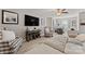 Inviting living room with a sofa, a ceiling fan, and a mounted TV at 919 Pennington Dr, Indian Land, SC 29720